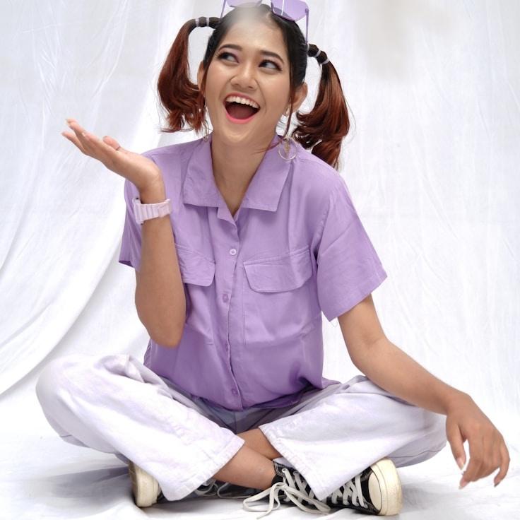 Ariel Singh, Lead Design Curator at Meadow Crest Grove, reviewing corporate floral arrangements